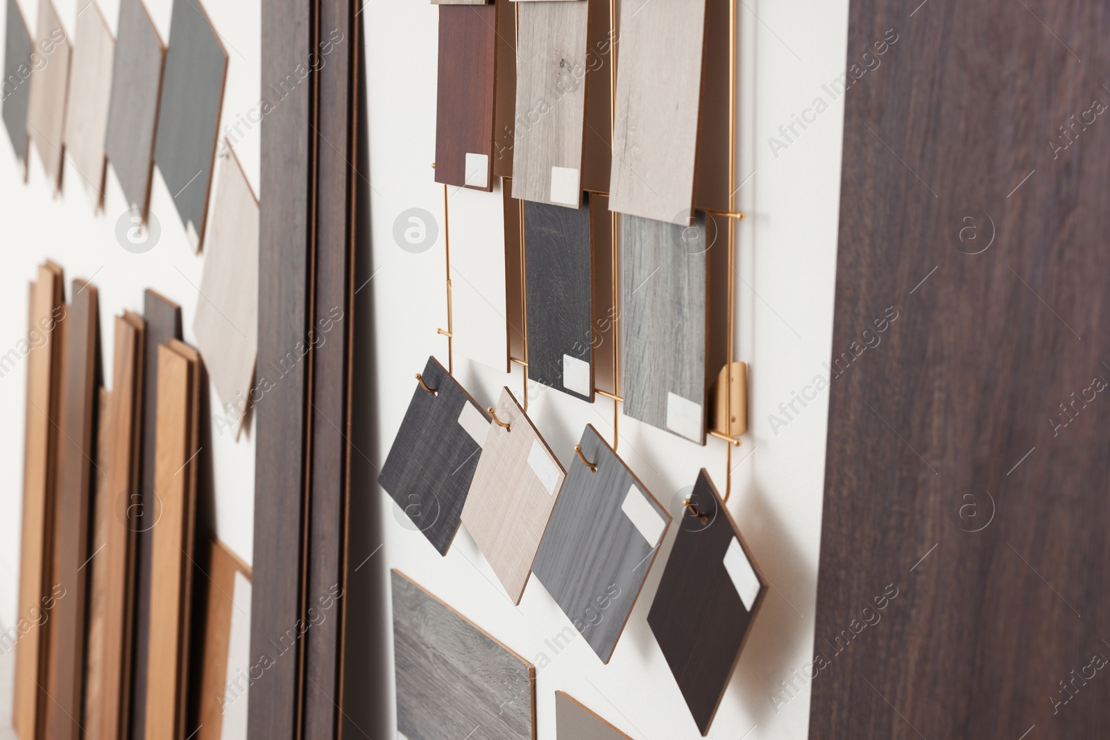 Photo of Many different samples of wooden flooring in store