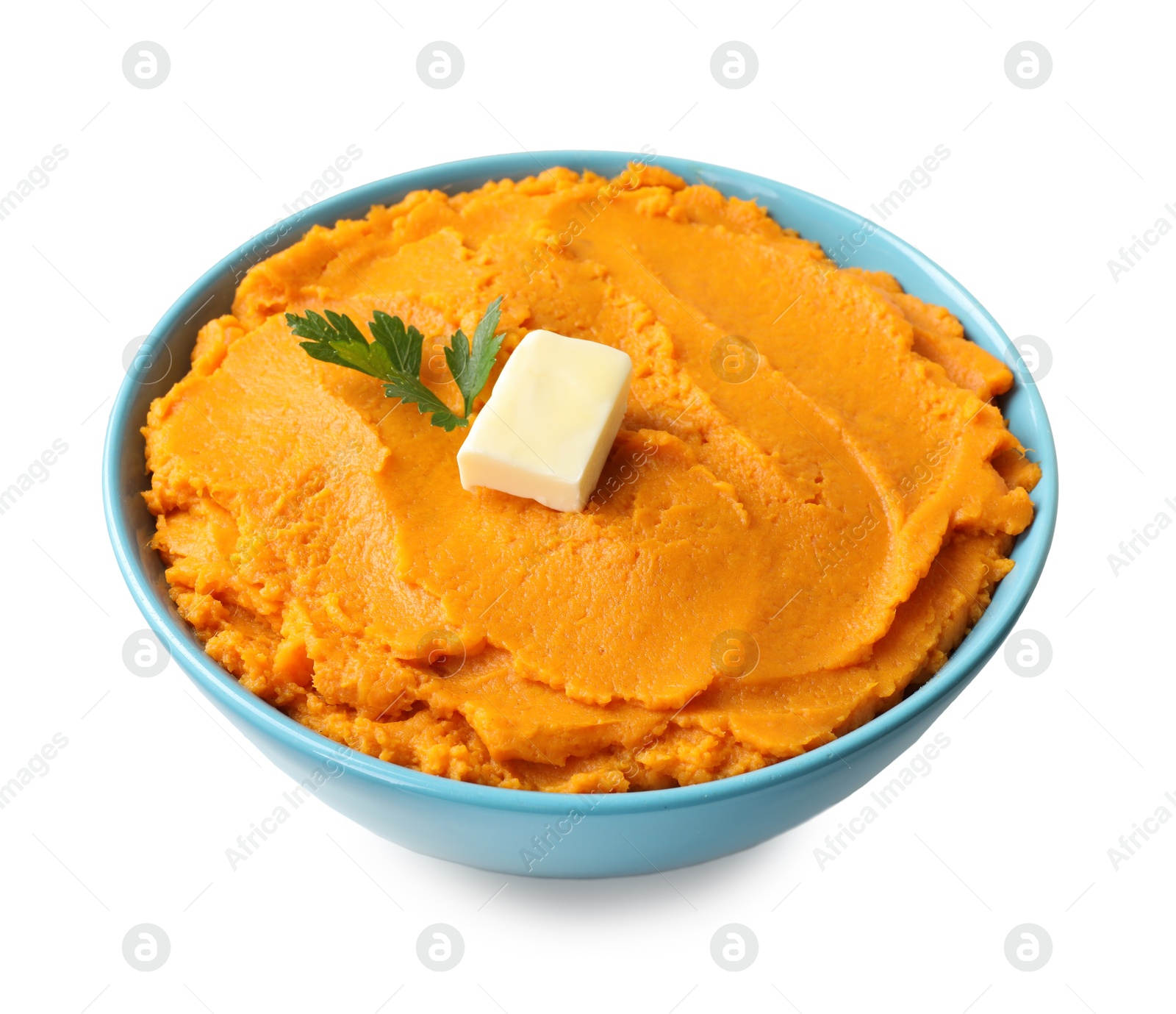 Photo of Tasty mashed sweet potato with butter and parsley in bowl isolated on white