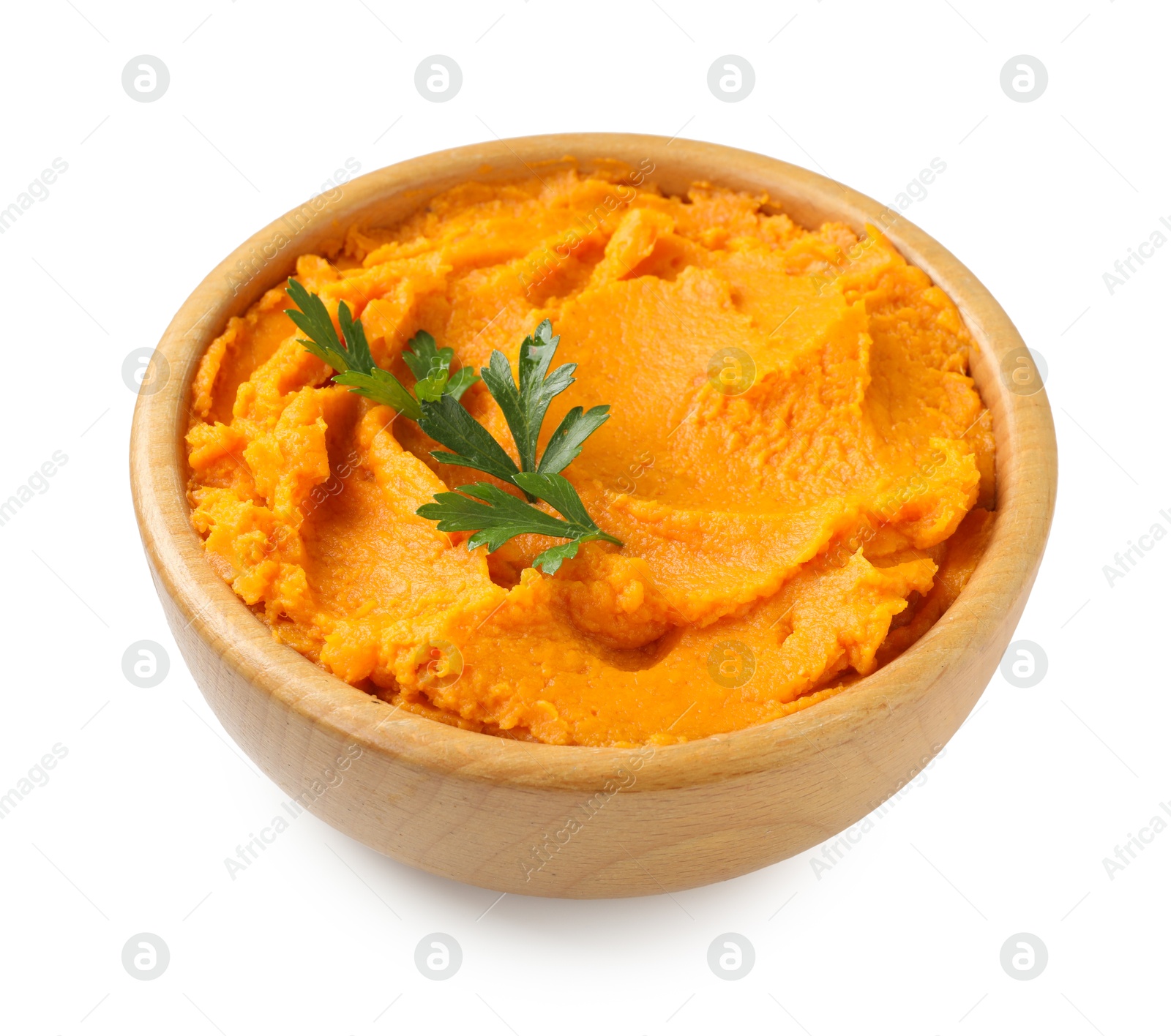 Photo of Tasty mashed sweet potato and parsley in bowl isolated on white