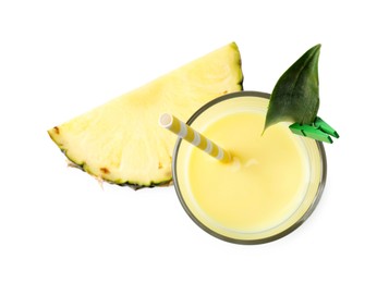 Photo of Tasty pineapple smoothie in glass and slice of fruit isolated on white, top view