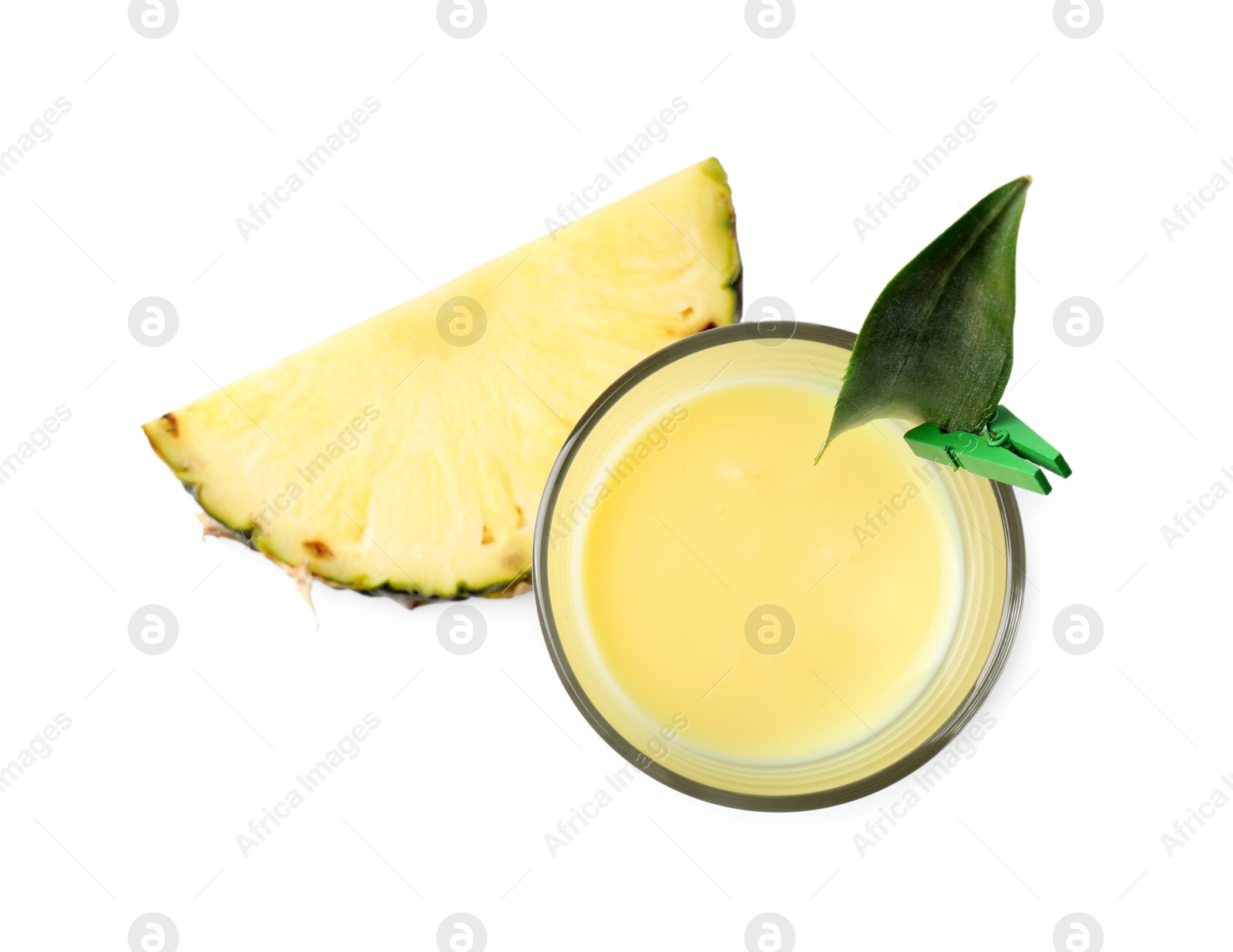 Photo of Tasty pineapple smoothie in glass and slice of fruit isolated on white, top view