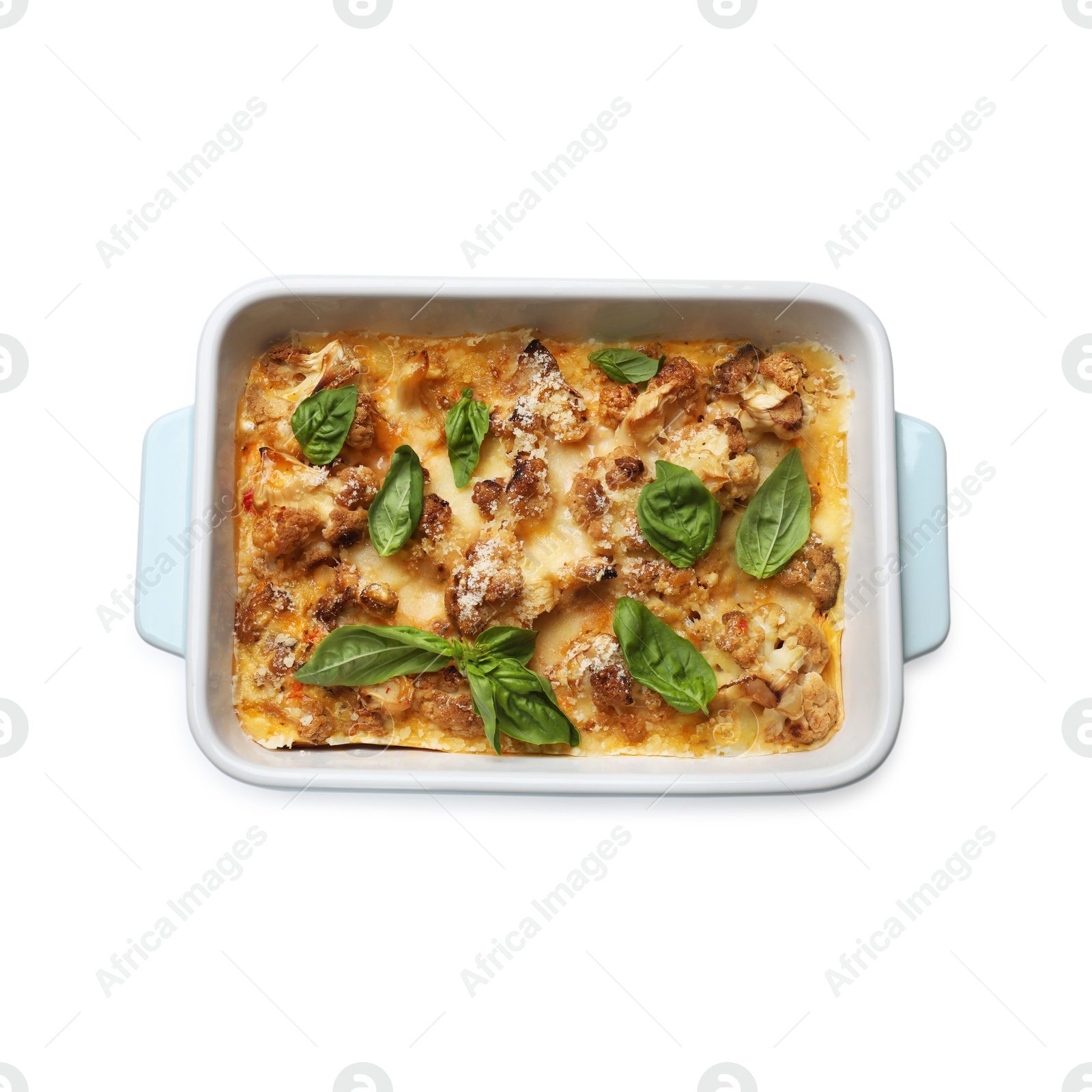 Photo of Tasty baked cauliflower and basil in baking dish isolated on white, top view