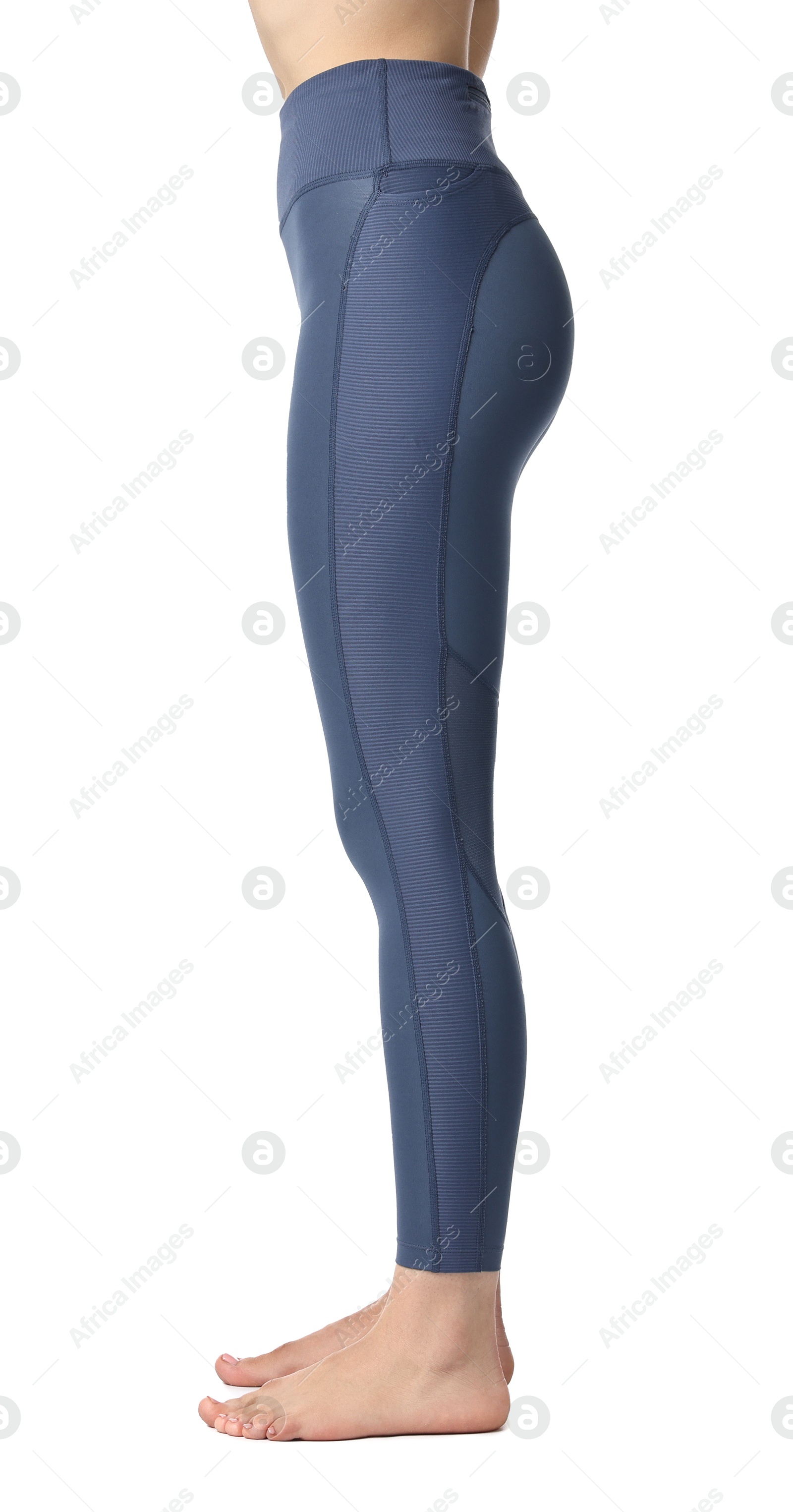 Photo of Woman wearing sports leggings on white background, closeup