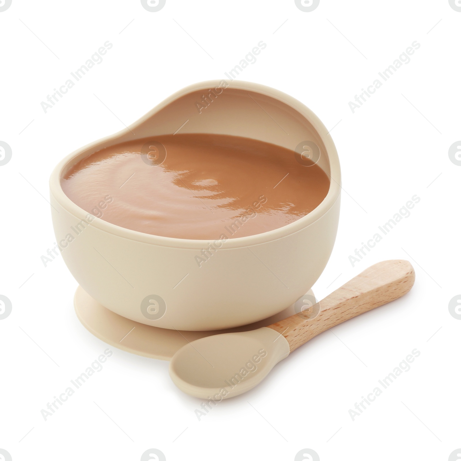 Photo of Tasty baby food in bowl and spoon isolated on white