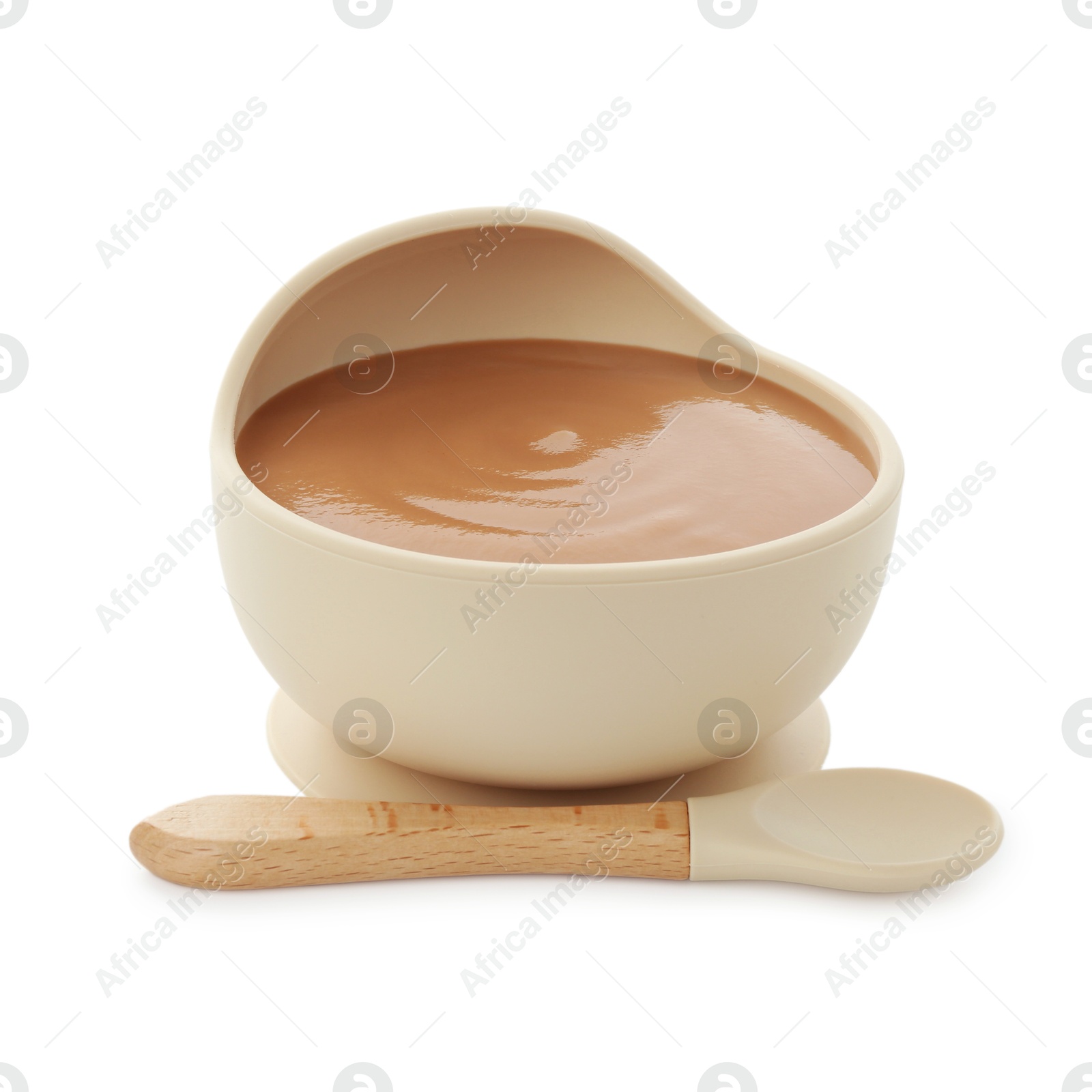 Photo of Tasty baby food in bowl and spoon isolated on white