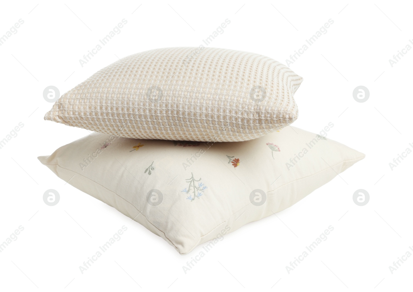 Photo of Stack of different pillows isolated on white