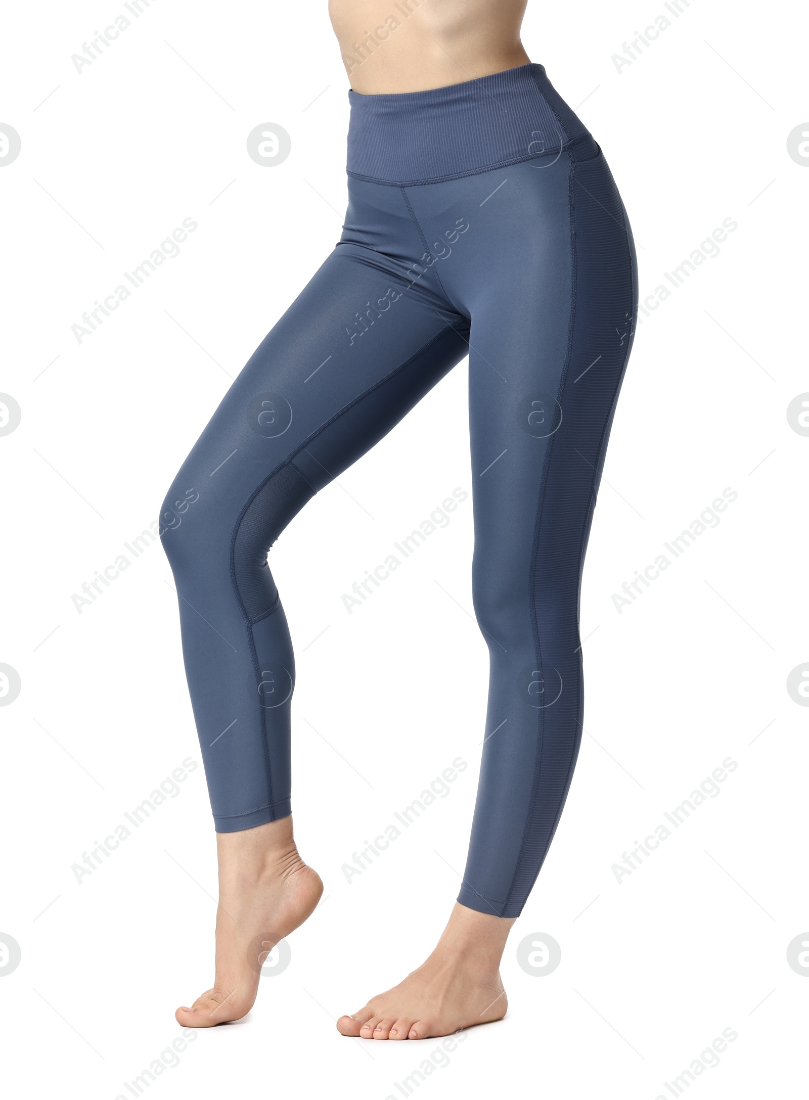 Photo of Woman wearing sports leggings on white background, closeup