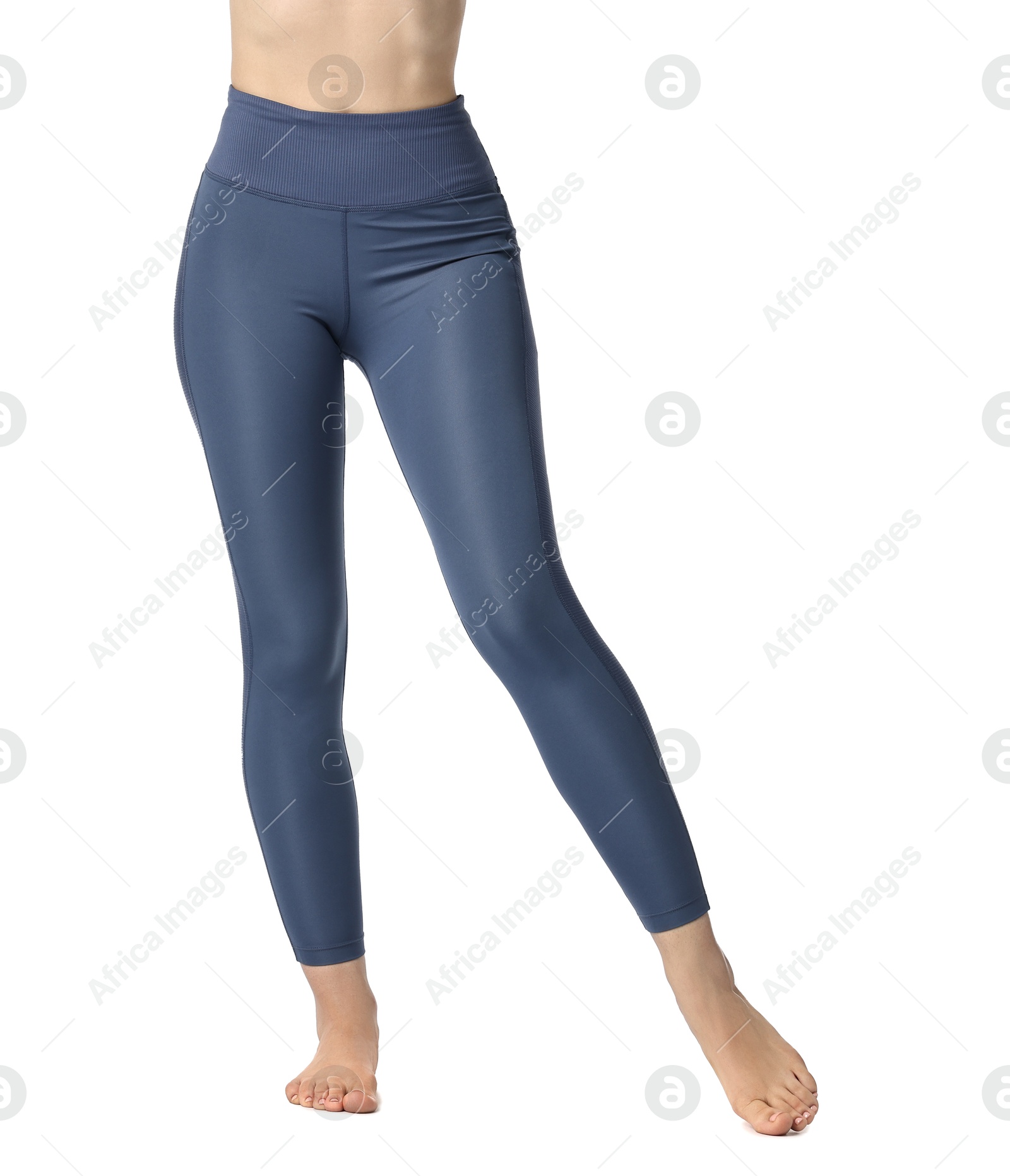 Photo of Woman wearing sports leggings on white background, closeup