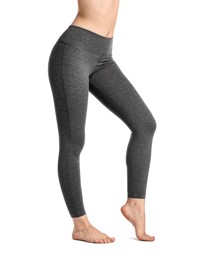 Photo of Woman wearing sports leggings on white background, closeup