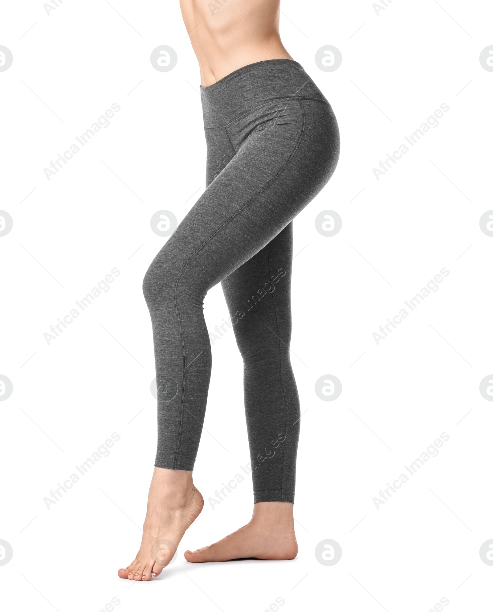 Photo of Woman wearing sports leggings on white background, closeup