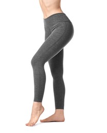 Photo of Woman wearing sports leggings on white background, closeup