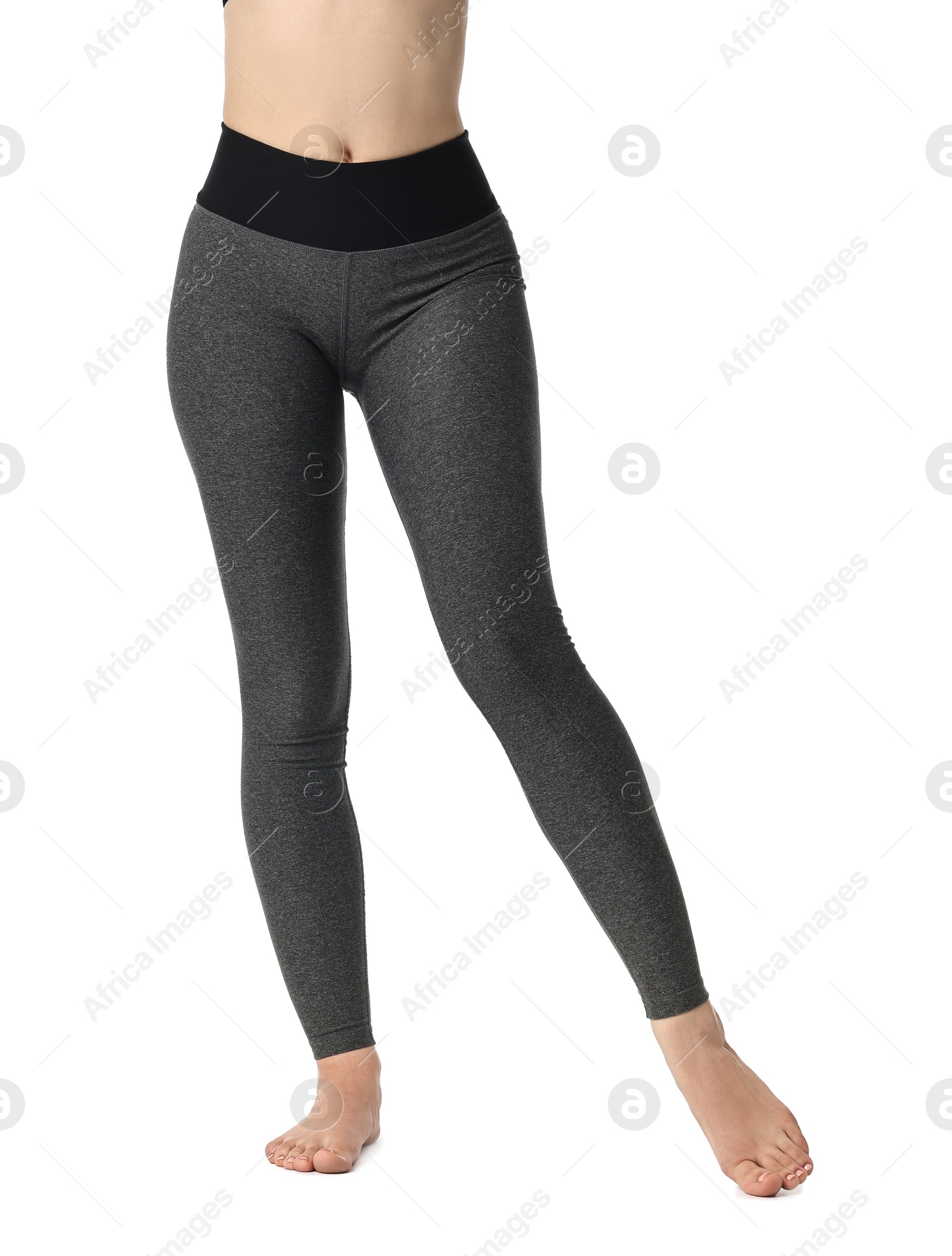 Photo of Woman wearing sports leggings on white background, closeup