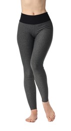 Photo of Woman wearing sports leggings on white background, closeup