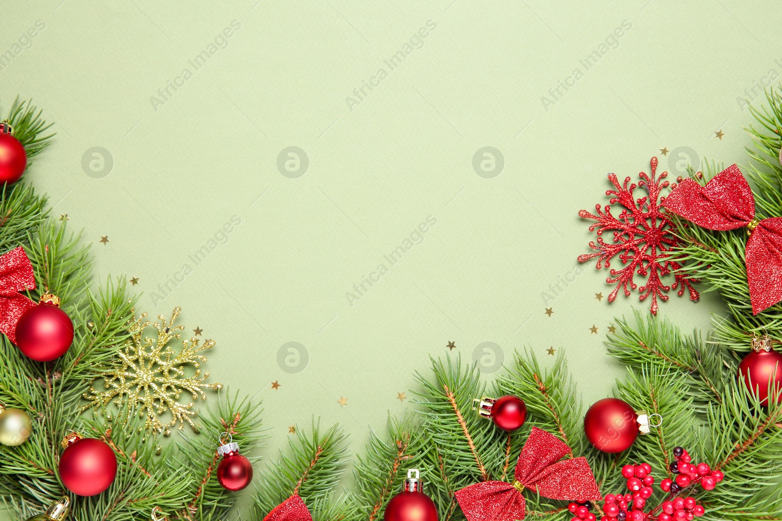 Photo of Flat lay composition with Christmas decor on green background, space for text