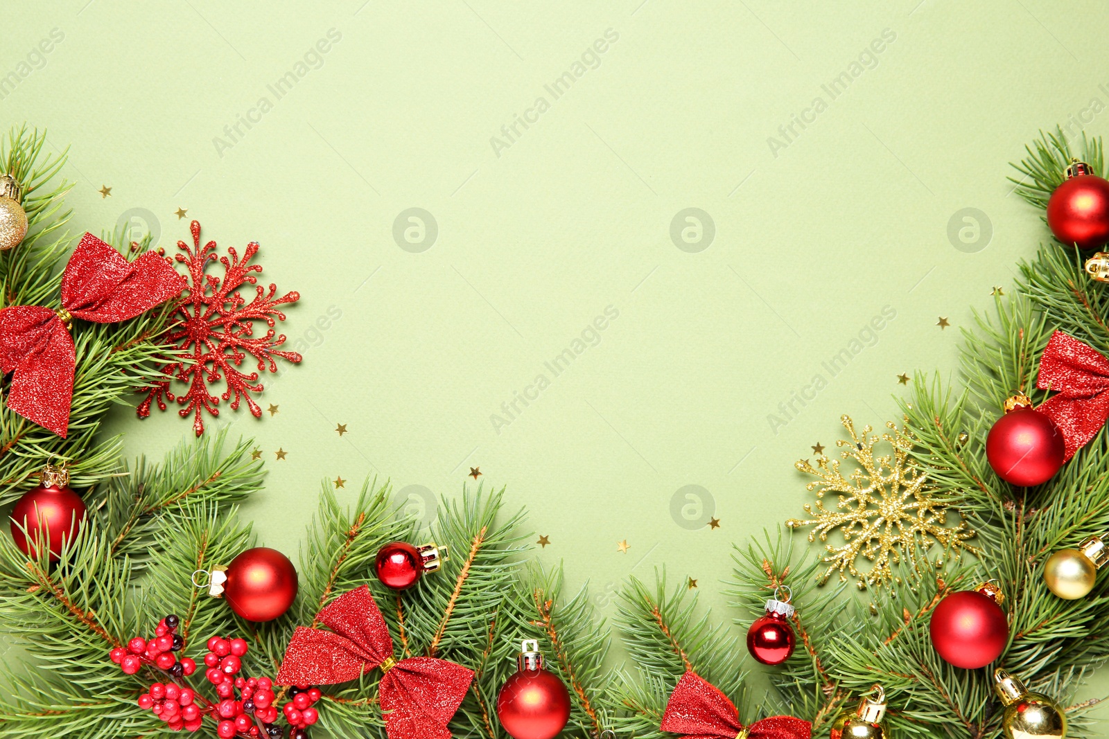 Photo of Flat lay composition with Christmas decor on green background, space for text