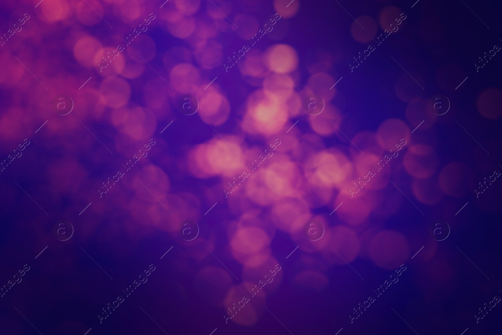 Image of Pink blurred lights on blue gradient backdrop, bokeh effect. Halloween background