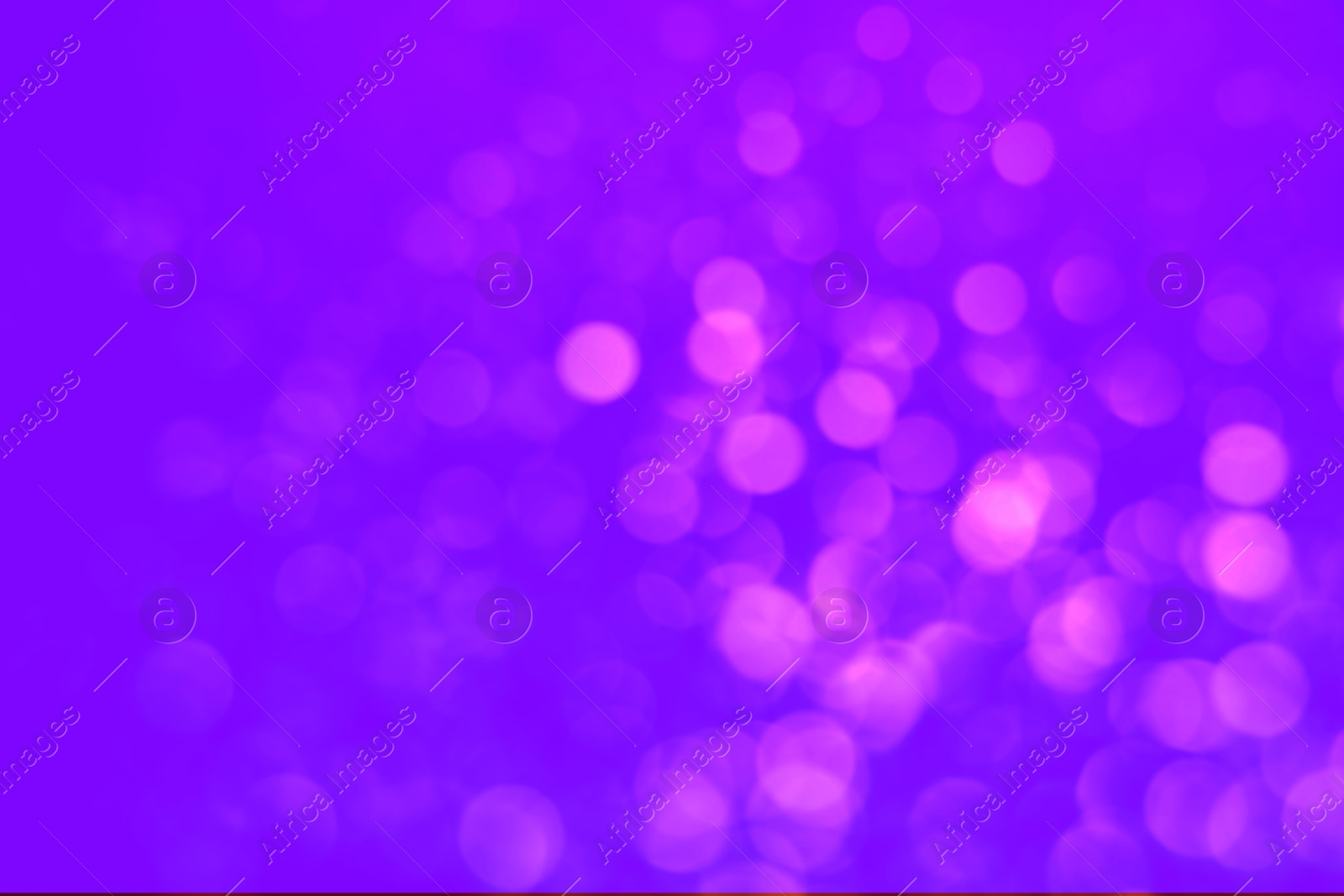 Image of Pink blurred lights on violet backdrop, bokeh effect. Halloween background