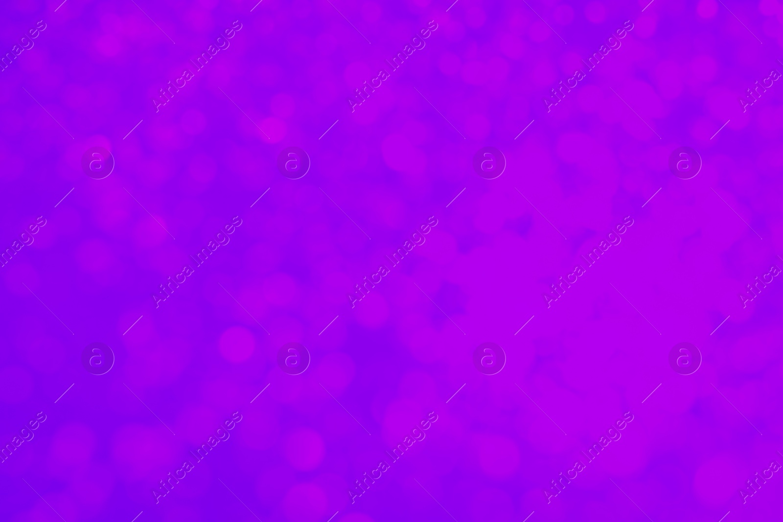 Image of Pink blurred lights on violet backdrop, bokeh effect. Halloween background