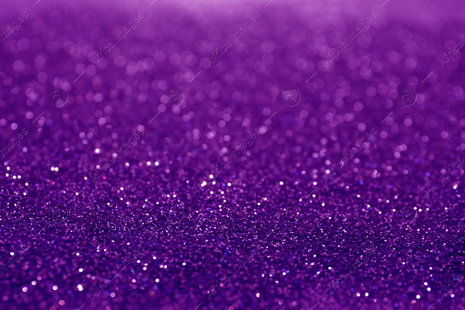 Image of Shiny purple glitter, closeup. Halloween background, bokeh effect