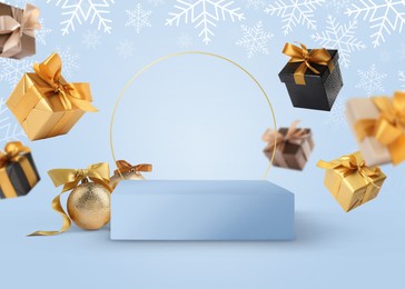 Image of Stage for stylish presentation with Christmas balls, snowflakes, empty podium and gift boxes on light blue background. New Year poster or sale flyer design