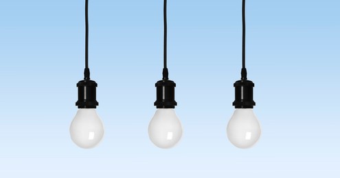 Image of Incandescent light bulbs on light blue background. Banner design