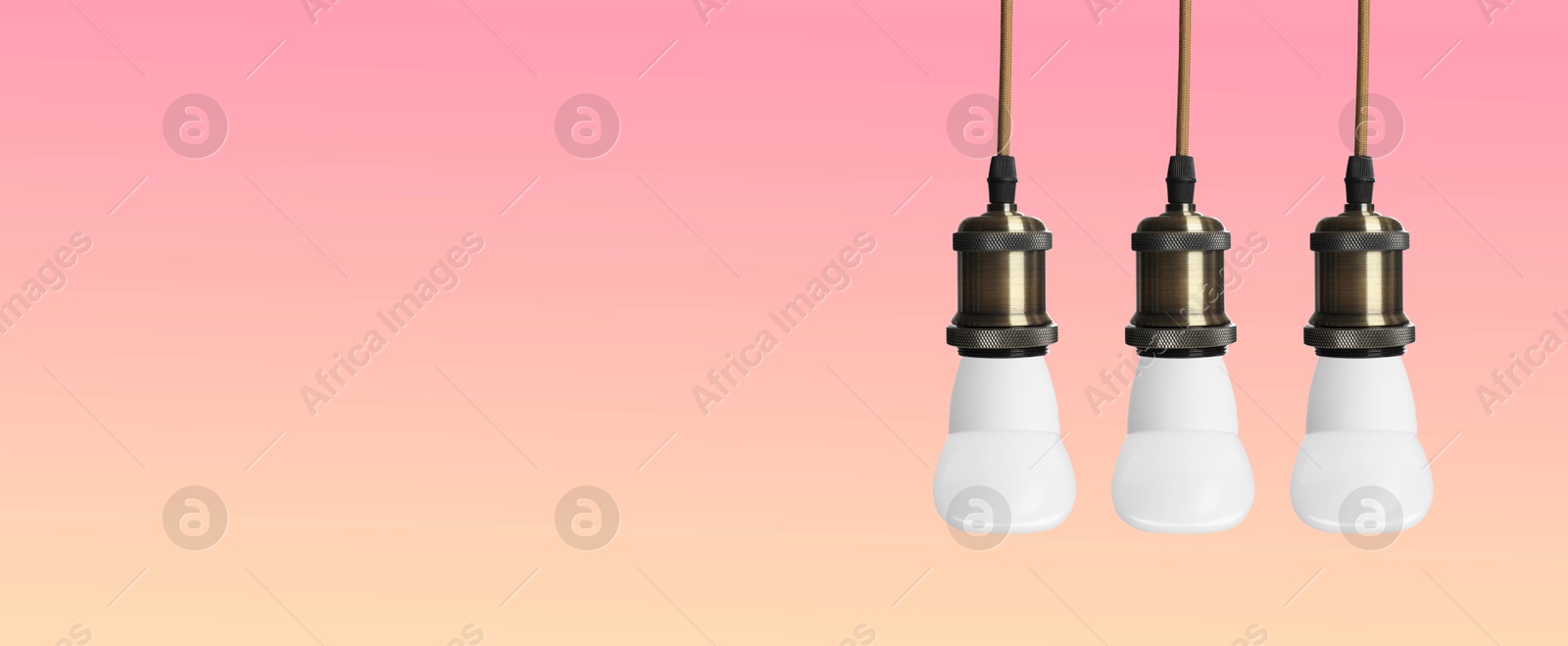 Image of Incandescent light bulbs on color gradient background, banner design with space for text