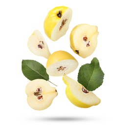 Image of Pieces of fresh quinces and green leaves falling on white background