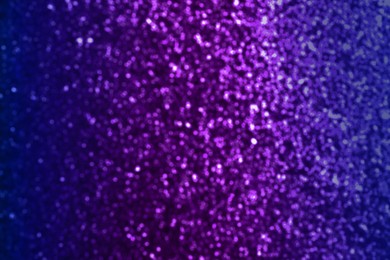 Image of Shiny purple and blue glitter, bokeh effect. Halloween background