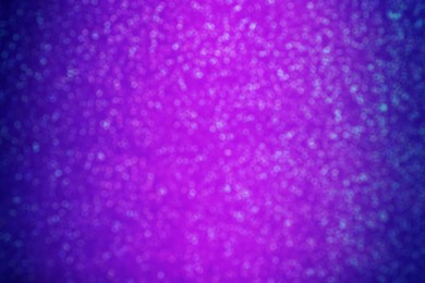 Image of Shiny violet and blue glitter, bokeh effect. Halloween background