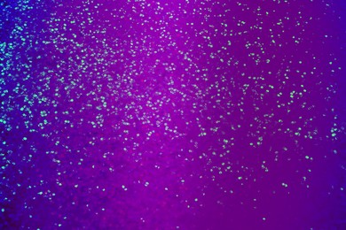 Image of Shiny violet and blue glitter. Halloween background