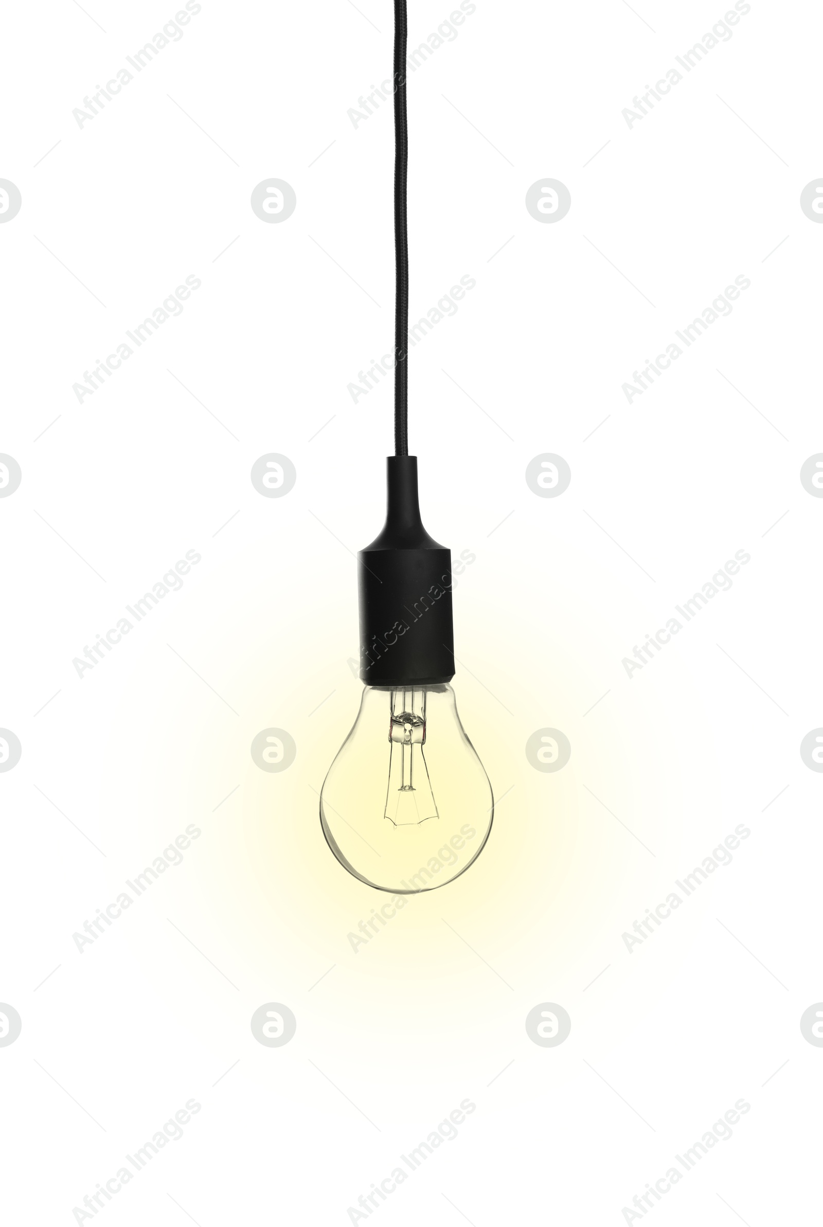 Image of One glowing light bulb hanging on white background