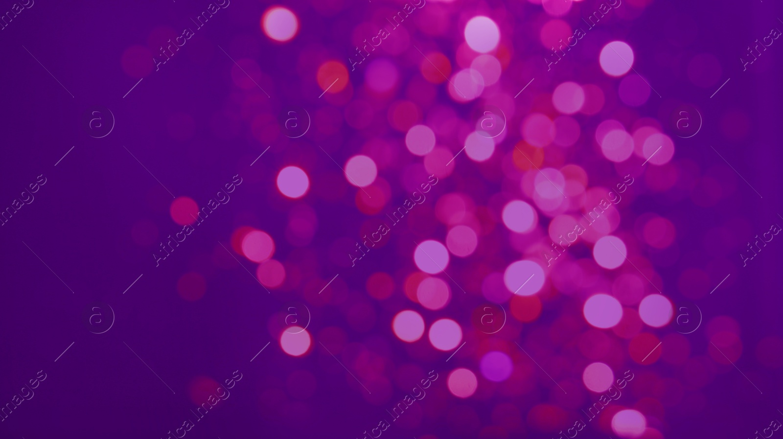 Image of Colorful blurred lights on purple backdrop, bokeh effect. Halloween background