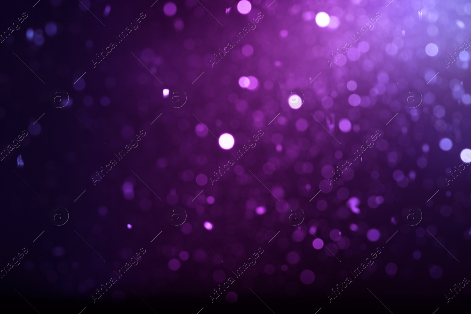 Image of Purple and black gradient backdrop, bokeh effect. Halloween background