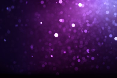 Image of Purple and black gradient backdrop, bokeh effect. Halloween background