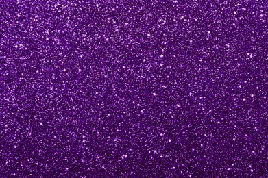 Image of Shiny dark violet glitter, top view. Halloween background