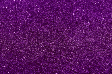 Shiny purple glitter, closeup. Halloween background, bokeh effect