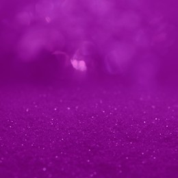 Image of Shiny light purple glitter, closeup. Halloween background, bokeh effect