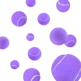 Image of Many violet tennis balls flying on white background