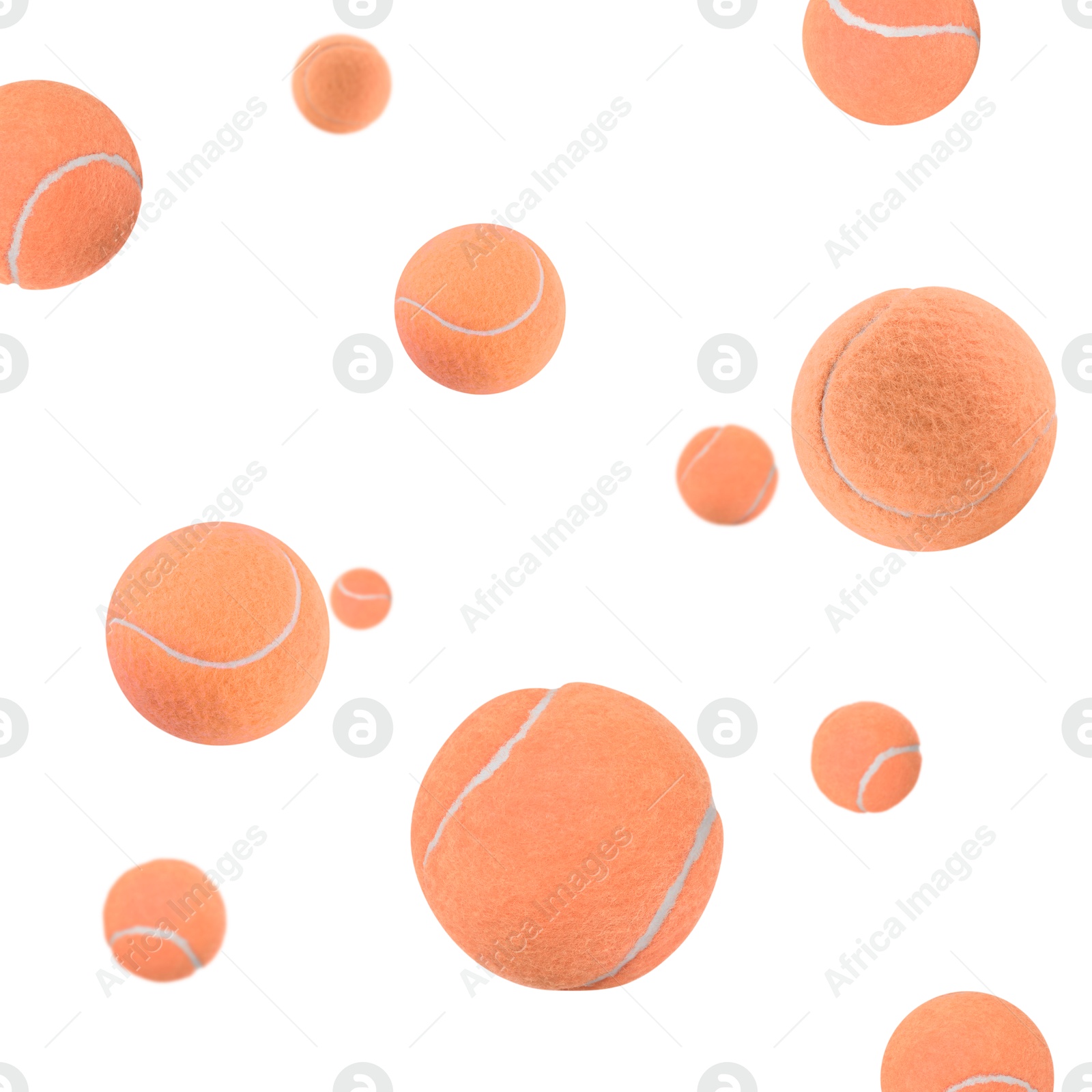 Image of Many coral tennis balls flying on white background