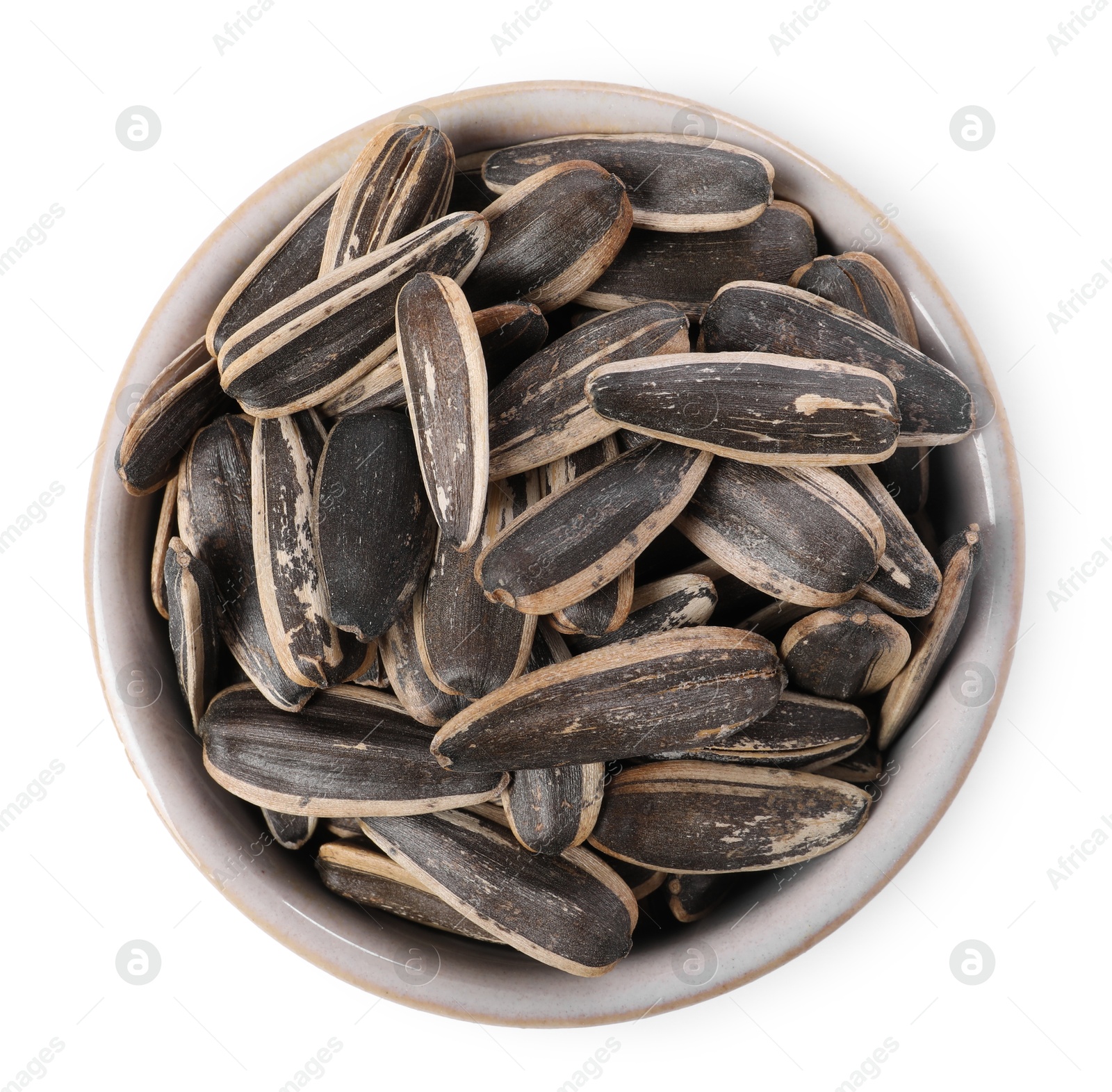 Photo of Sunflower seeds in bowl isolated on white, top view