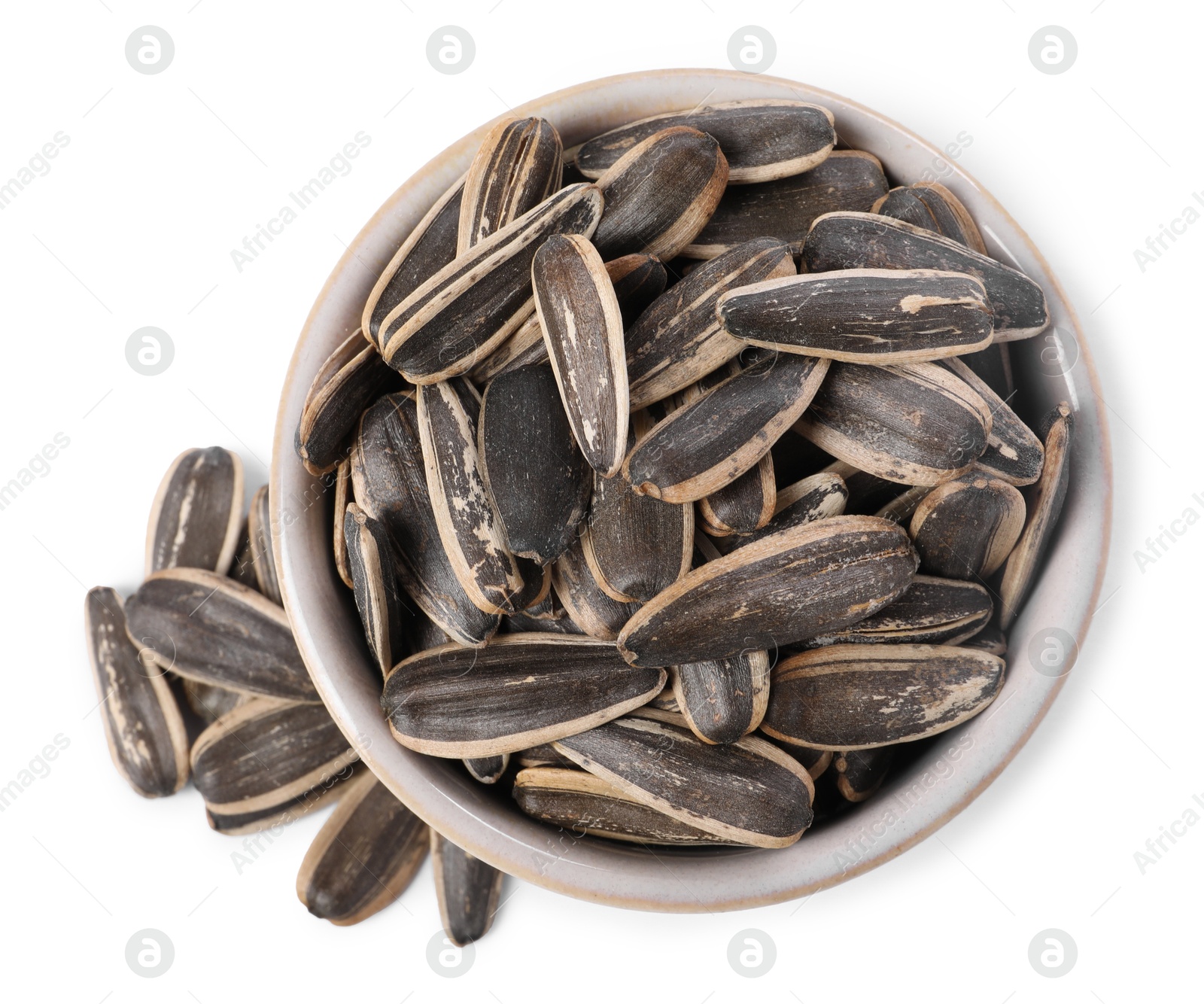 Photo of Sunflower seeds in bowl isolated on white, top view