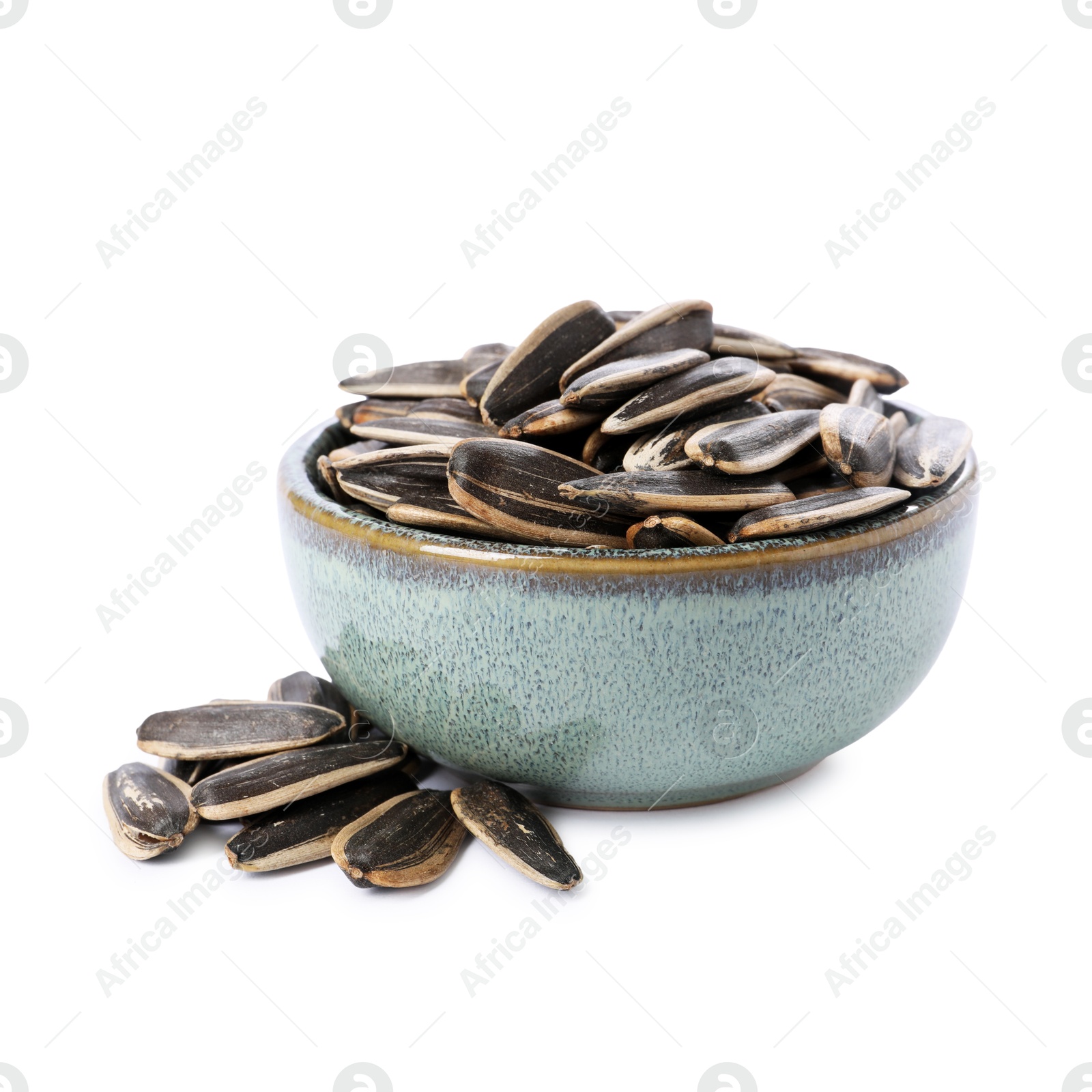 Photo of Sunflower seeds in bowl isolated on white