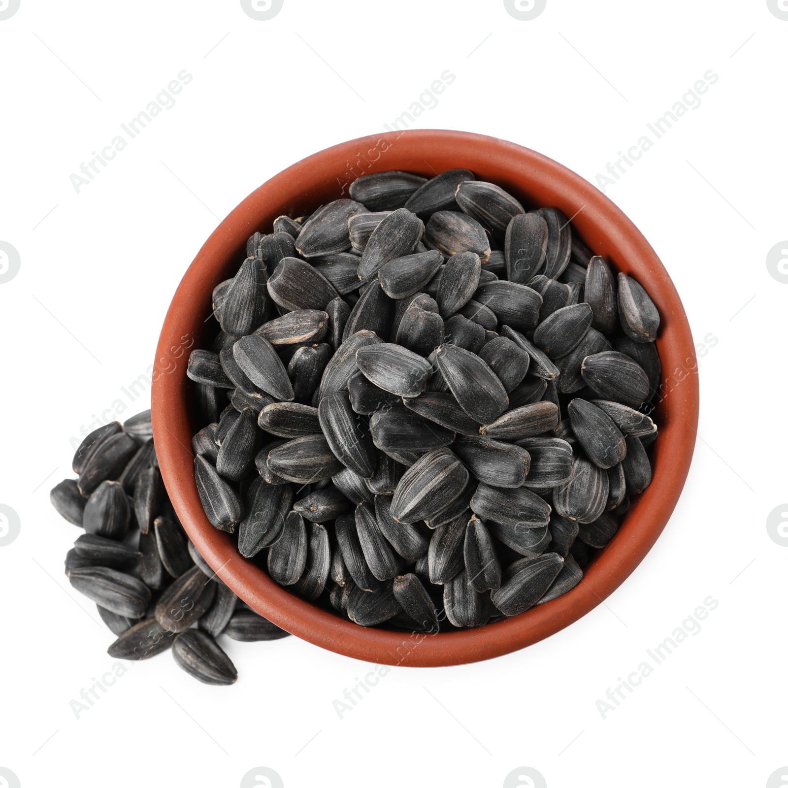 Photo of Sunflower seeds in bowl isolated on white, top view