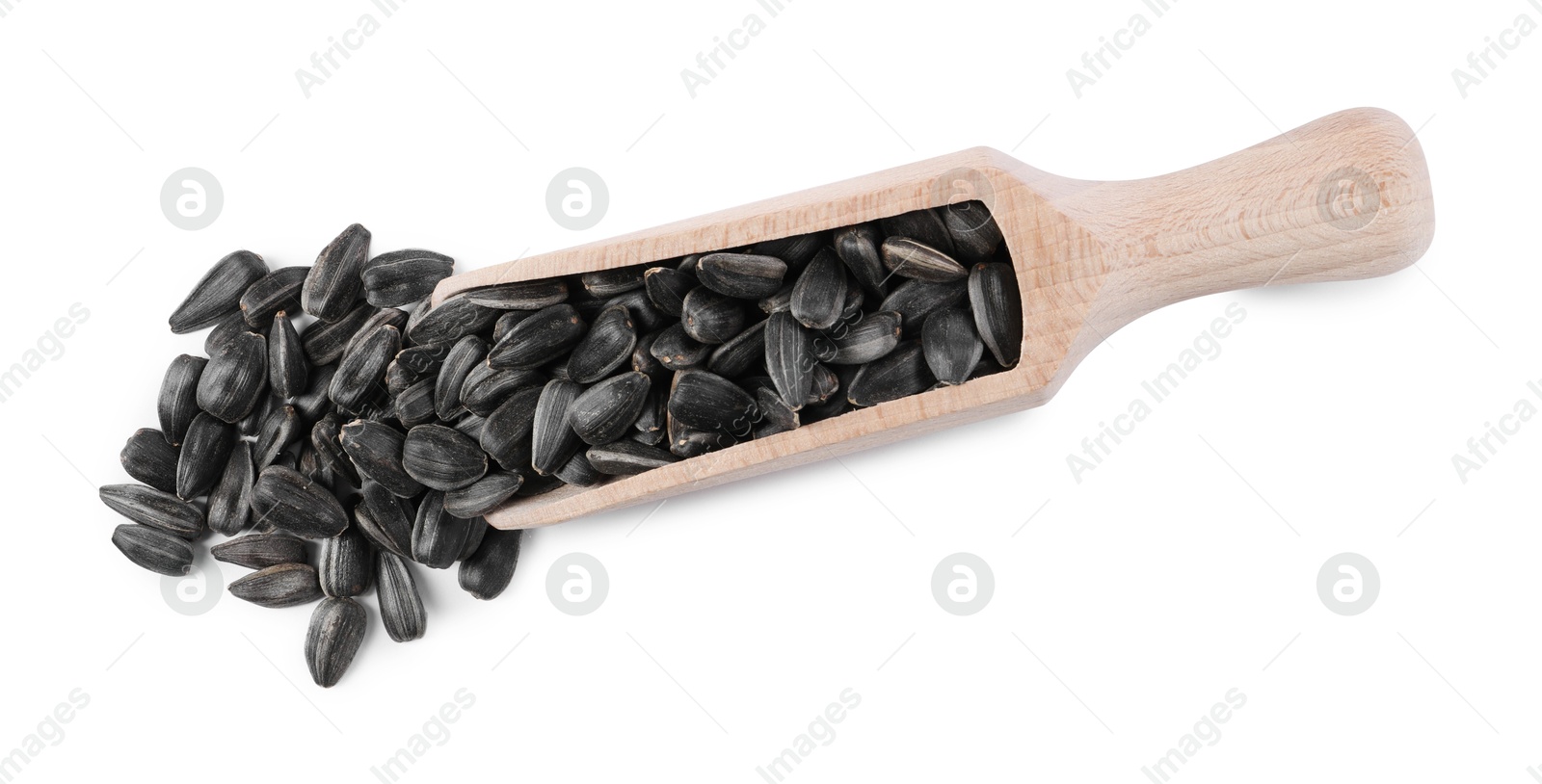 Photo of Sunflower seeds in wooden scoop isolated on white, top view