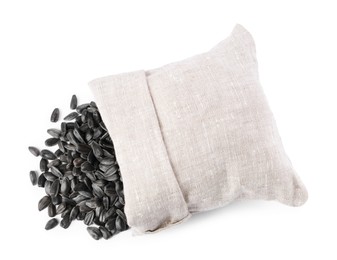 Sunflower seeds and overturned burlap sack isolated on white, top view