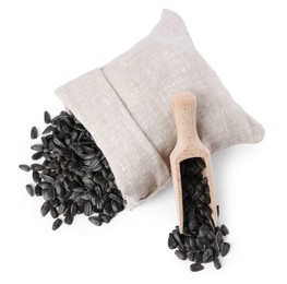 Photo of Sunflower seeds, overturned burlap sack and wooden scoop isolated on white, top view