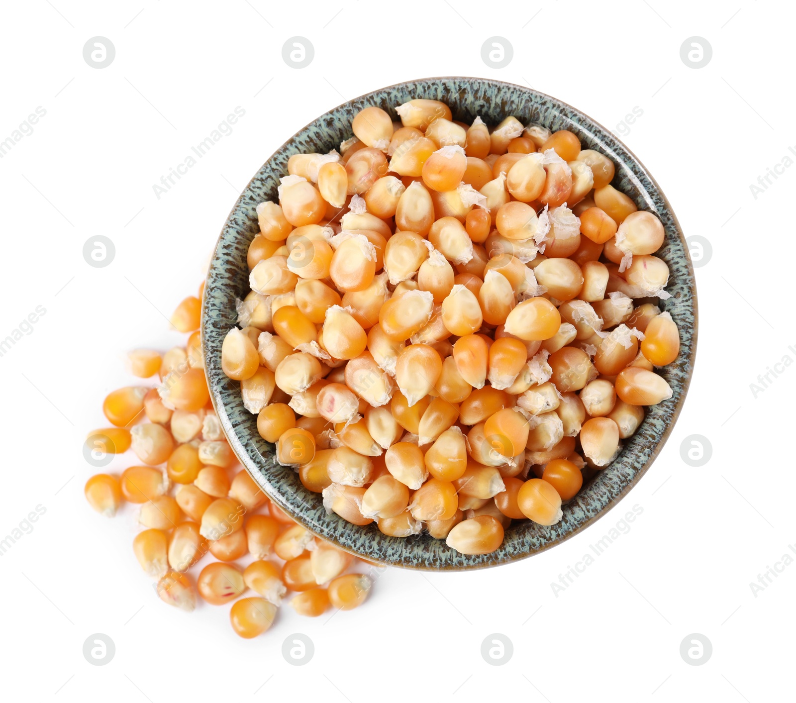 Photo of Fresh corn kernels in bowl isolated on white, top view