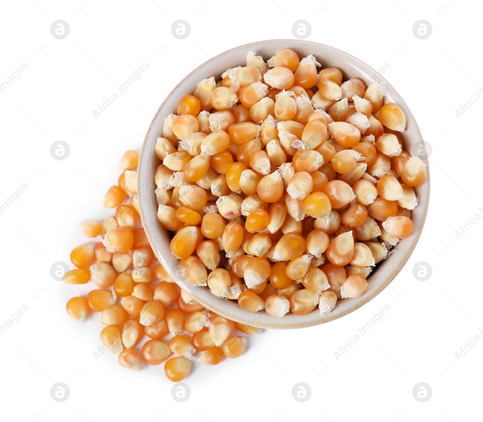 Photo of Fresh corn kernels in bowl isolated on white, top view