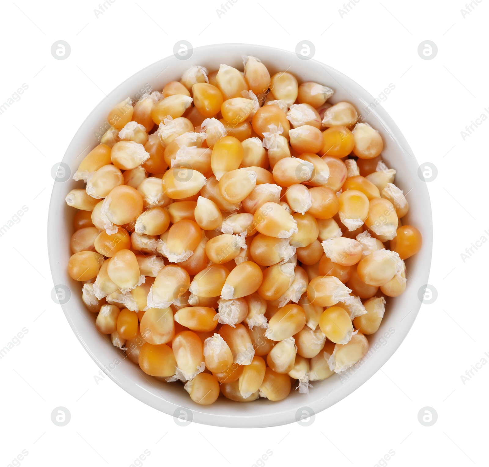 Photo of Fresh corn kernels in bowl isolated on white, top view