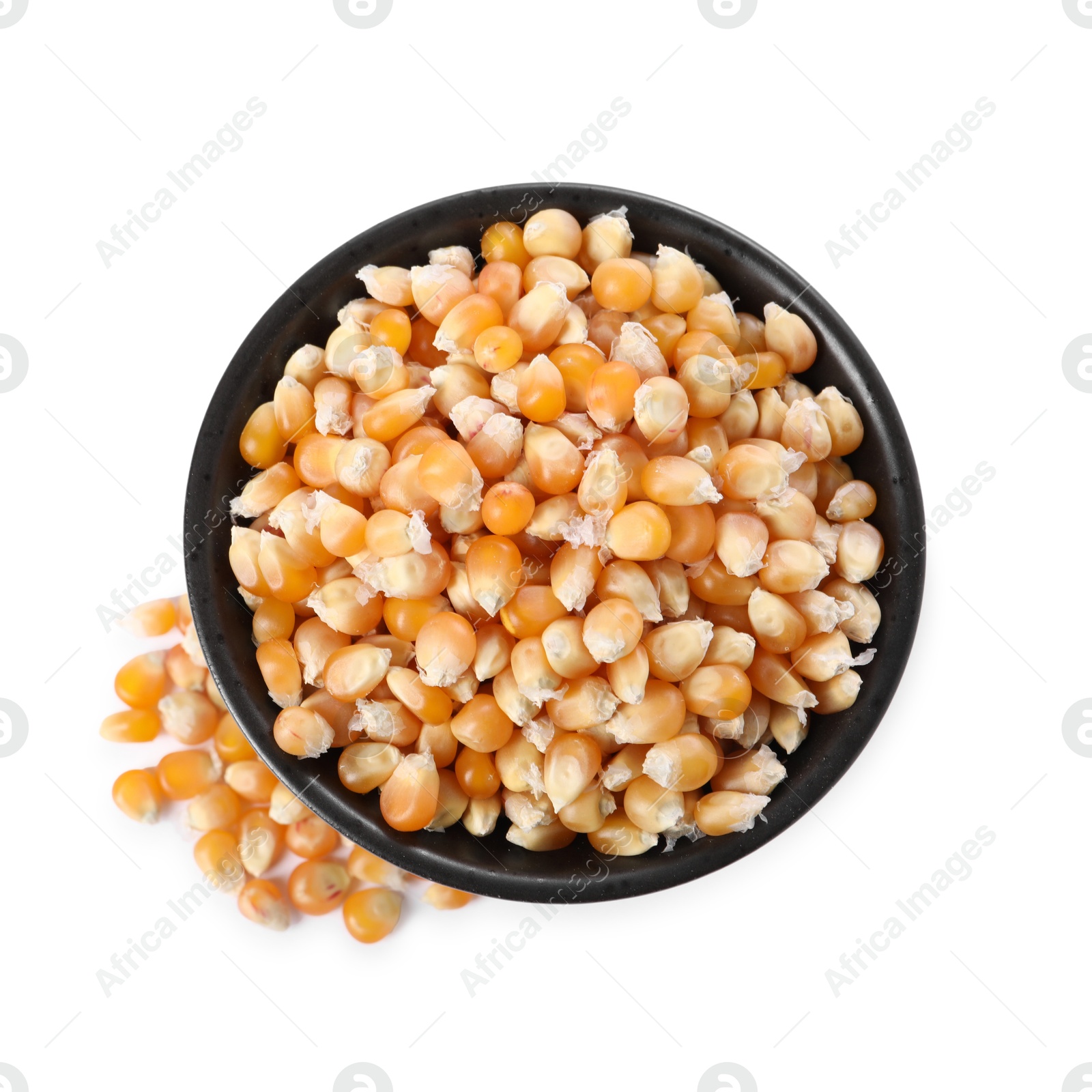 Photo of Fresh corn kernels in bowl isolated on white, top view